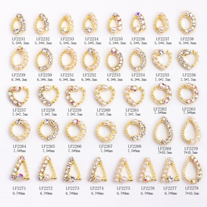 Detailed size chart for 40 assorted gold nail charms with pearls and rhinestones