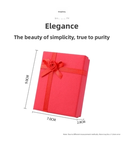 Macro detail of red 7x9cm jewelry gift box with satin ribbon and rose ornament