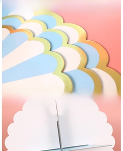 Detail of blue disposable paper cupcake stand with gold foil edge and assembly structure