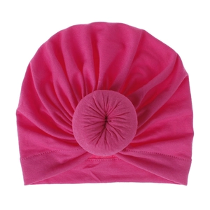 Soft hot pink pleated turban hat with a stylish donut knot detail for women or babies