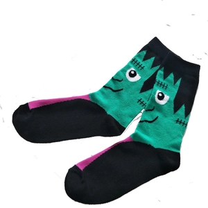Halloween Frankenstein crew socks featuring creative green and black cartoon knit patterns