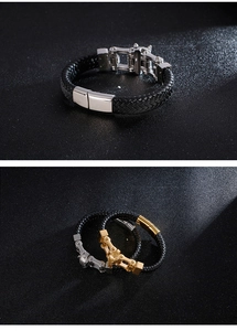 Detailed view of black braided leather bracelets with silver and gold metal chain clasps
