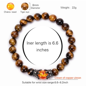 Natural tiger eye stone beaded bracelet featuring a copper crown and chakra bead detail