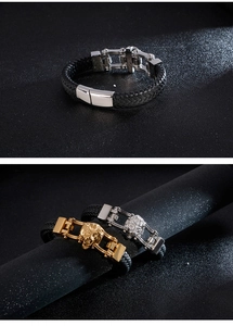 Detail of men's leather bracelet with lion head carving and metallic buckle