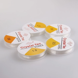 Top view of transparent crystal elastic cord rolls in 0.5mm to 1.0mm sizes for beadwork