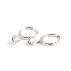 S925 sterling silver huggie earrings with round bezel-set zircon pendants on white background