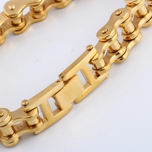 Macro shot of 12mm gold bicycle chain link bracelet in polished stainless steel