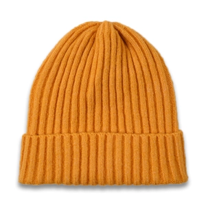 Close-up of bright yellow rib-knit beanie showing thick texture and folded cuff detail