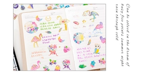 Detail of artistic gold-foiled crystal epoxy stickers with floral and animal motifs