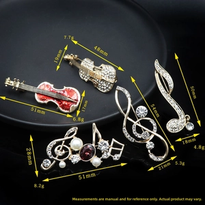Detailed size and weight specs for rhinestone music note and violin brooches