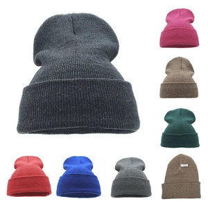 Women's winter knit beanie hat in various solid colors including black and pink