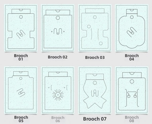 Multiple styles of PVC jewelry display cards with various hole shapes for brooches and pins