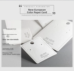 Detail of white jewelry display card with silver foil engraving and hanging holes