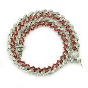 Macro view of silver Cuban link bracelet with red and white rhinestones and box clasp