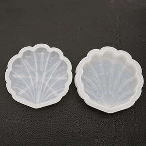 Detail of shell-shaped silicone molds showing internal ridges for DIY resin crafts