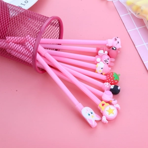 Cute pink cartoon gel pen set with strawberry charms in a metal mesh pencil holder