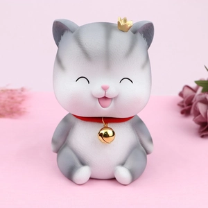 Cute grey cat piggy bank with gold crown and red collar for modern home desk decor