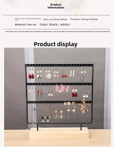 Three-tier black metal earring stand with round holes and natural wooden base detail