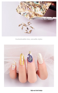 Macro shot of natural shell nail stickers showing DIY cutting process and 3D iridescent finish