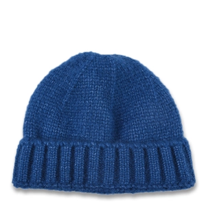 Close-up of blue knitted beanie with thick ribbed cuff and coarse texture pattern