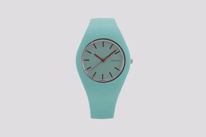 Detailed macro view of teal silicone Geneva watch featuring red hands and minimalist markers