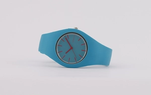 Close-up of Geneva silicone watch featuring a blue strap and red markers on white background