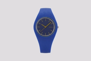 Close-up of Geneva watch with navy blue silicone strap and vibrant yellow hands