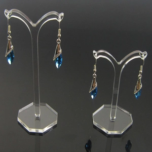 Clear acrylic T-shaped earring display stand with hexagonal base and blue crystals