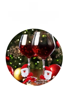 Close-up of Santa Claus plush wine glass marker ring for Christmas table decoration