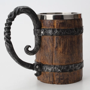 Detailed macro view of medieval barrel beer mug with stainless steel liner and resin wood texture