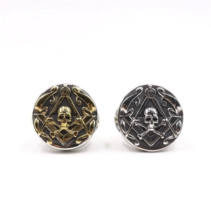 Detailed macro view of vintage stainless steel masonic skull rings in gold and silver finish