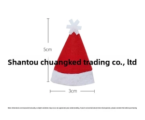 Mini red Christmas hat cutlery holder detail showing soft felt fabric and star ornament