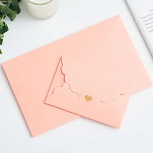 Pink pearlescent envelope set with gold heart seal shown in large and mini sizes