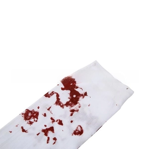 Detail of white over-the-knee socks with red blood splatter print for Halloween cosplay