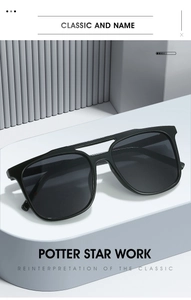 Close-up of black square double-bridge sunglasses on a modern geometric display stand