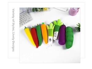 Variety of realistic fruit and vegetable silicone pencil cases arranged on a white desk