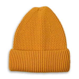 Close-up of the ribbed mustard yellow knit beanie showing vertical texture and wide cuff