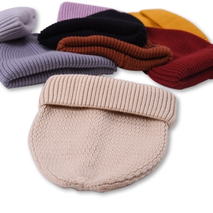 Multiple colors of ribbed knit beanies for men and women featuring a classic folded cuff