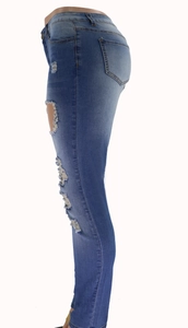Detailed side view of high-waist skinny blue distressed jeans with ripped knee design