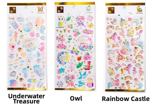 Detailed view of three decorative gold-stamped crystal stickers for DIY journaling