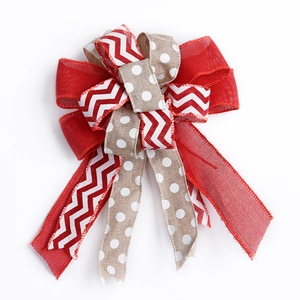 Red and linen layered Christmas bow decoration with chevron patterns and white polka dots