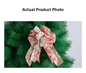 Detail of burlap Christmas tree bow with Merry Christmas print on green pine branches