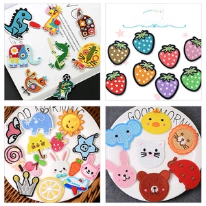 Detail shot of assorted cartoon chenille patches with various animal and fruit shapes