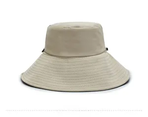 Detail of beige sun hat featuring breathable mesh fabric and adjustable windproof drawstring