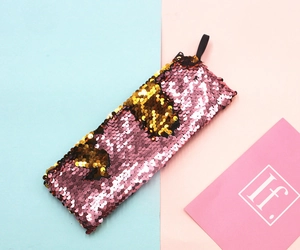 Close-up of pink and gold reversible sequins on a versatile student stationery pouch
