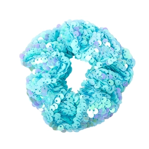 Glittering blue and teal gradient mermaid sequin scrunchie hair tie on white background