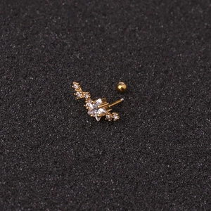 Gold star cartilage stud with clear star gemstone and sparkling zircon crystals
