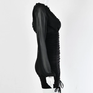 Detail of black V-neck dress featuring mesh sleeves and ruched bodycon design