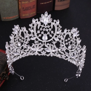 Baroque silver bridal crown with sparkling crystals on a vintage black background