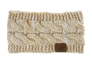 Macro detail of cable knit texture and leather brand label on warm winter headband